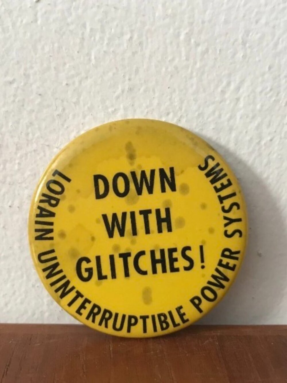 1970's Lorain Power Systems DOWN WITH GLITCHES 2" Pinback Button Yellow Vintage